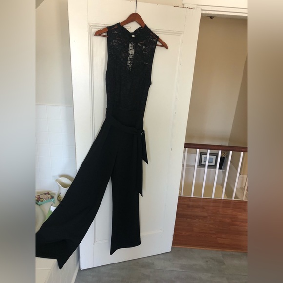 Black romper, Eclipse size M, fits size 8-10. Hand wash, 100% polyester - Picture 1 of 11